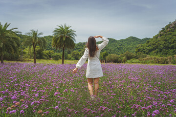 woman standing in lavender field .