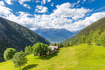 Lonely traditional hut in a wild alpine valley, Val d'Arigna, Orobie, Valtellina, Lombardy, Italy