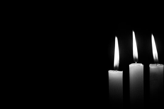 The concept of mourn,Candle dark on black background,RIP,Black and white photo