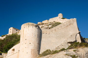 Low angle view of the massive stone walls and defensive towers of the citadel, Bonifacio, Corse-du-Sud