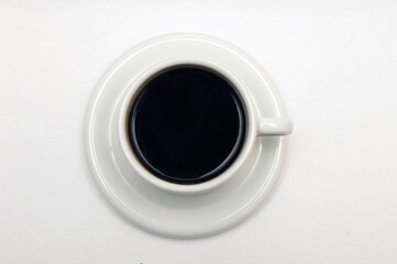 Obraz na płótnie Canvas black coffee in a white cup