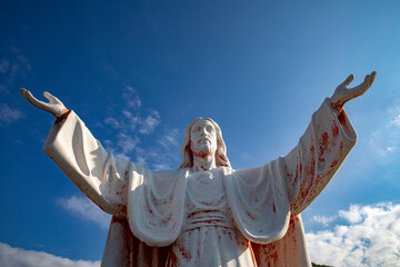 Statue of Jesus Christ with open arms in Delaj, Montenegro