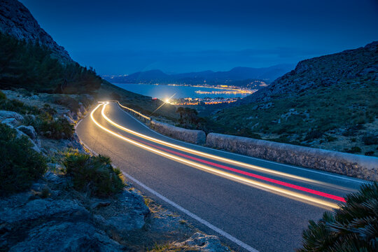 View of trail lights on road to Port de Pollenca at Mirador Es Colomer, Pollenca, Majorca, Balearic Islands
