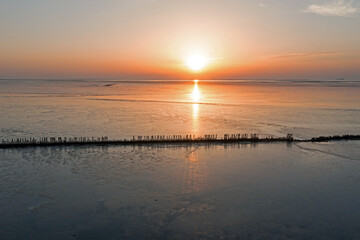 Aetrial from sunset at the Wadden Sea in the Netherlands