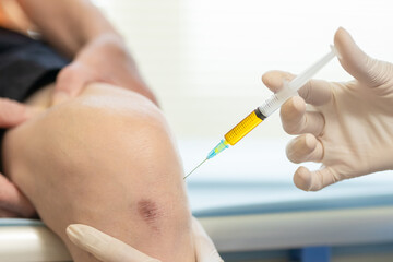 doctor make injection in knee