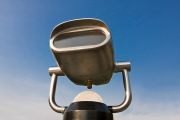 A viewfinder at a viewing point, blue sky background.
