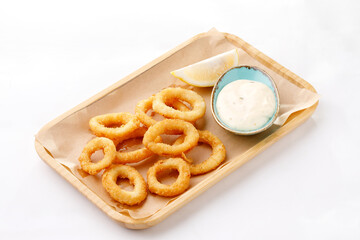 Onion Fries with sauce on a white background