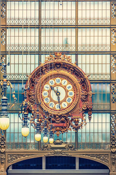 Huge clock in an ancient train station in Paris city