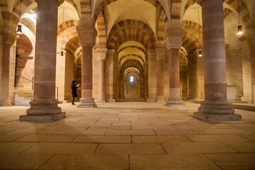 Fototapeta na wymiar Magnificent view of the monumental crypt of the Speyer Cathedral in Germany, the largest Romanesque columned hall crypt in Europe. Forty-two groin-vaults are supported on twenty cylindrical columns.