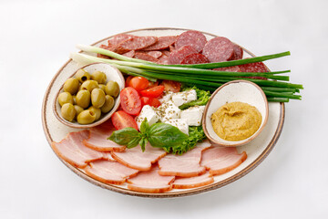 Beautifully arranged cut salami on a white background