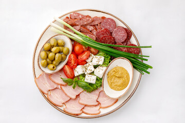 Beautifully arranged cut salami on a white background