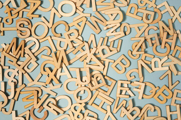 wooden letter all over the green background, alphabet, words