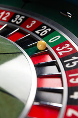 Obraz premium Image with casino roulette wheel with ball on number 0.