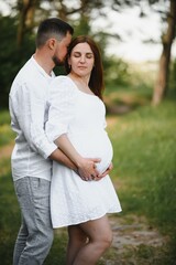 Fototapeta premium Portrait of lovely future parents during sunset