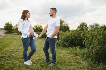 Portrait of lovely future parents during sunset