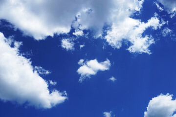 Blue sky with small cumulus clouds