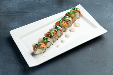 Rolls with avocado, salmon and rice.