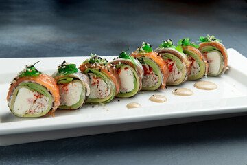 Rolls with avocado, salmon and rice.