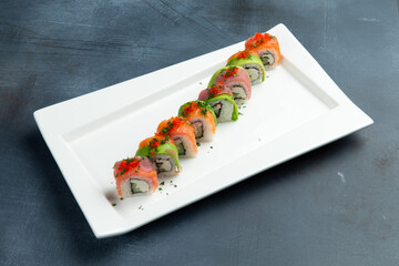 Rolls with avocado, salmon and rice.