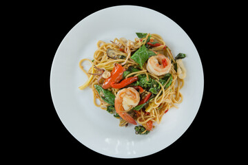 Top view of Spaghetti with spicy prawn and squid, focus selective