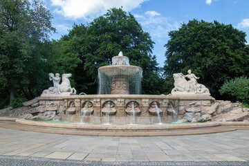Obraz premium Wittelsbach Fountain, built in the late 1800s, featuring 2 stately statues and illuminated waters, Munich, Germany