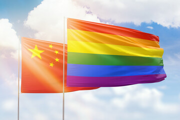 Sunny blue sky and flags of lgbt and china