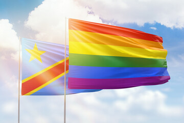 Sunny blue sky and flags of lgbt and dr congo