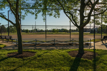 early sunrise at a baseball field in a municipal park