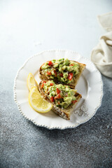 Homemade avocado toast with tomatoes