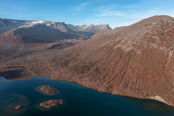 The beautiful blue lake is mountain peaks. Mountain landscape in Kola Peninsula, Arctic, tundra