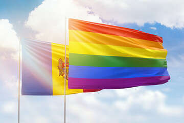 Sunny blue sky and flags of lgbt and moldova
