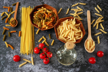 Various types of pasta, Raw pasta set and tomato, set