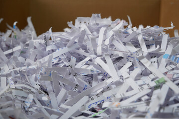 .Heap of white shredded papers background