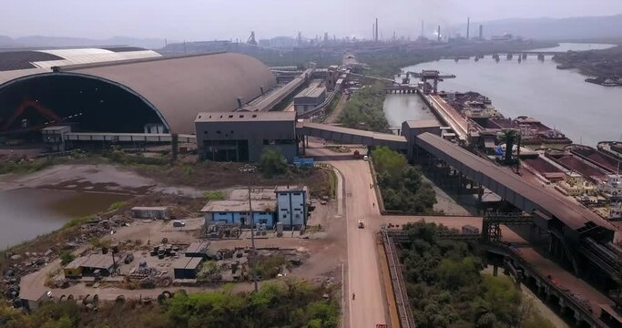 Aerial View Of Industrial Port And Steel Manufacturing Plant At The Bank Of Amba River In Dolvi, Maharashtra, India.