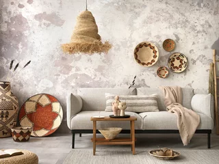 Peel and stick wall murals Boho Style The stylish ethnic composition at living room interior with grey sofa, colorful wicker, straw lamp, bench and elegant personal accessories. Grey concrete wall. Cozy apartment. Home decor.