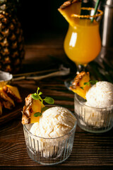 Delicious pineapple ice cream sorbet sundae. Summer food concept.