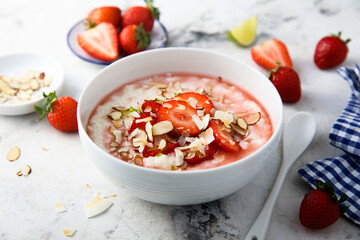 Homemade porridge with strawberry and almond