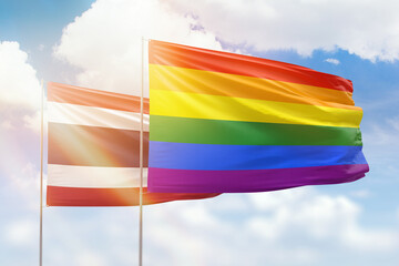 Sunny blue sky and flags of lgbt and thailand