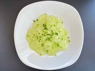 cucumber salad on a plate. sliced ​​cucumber.
