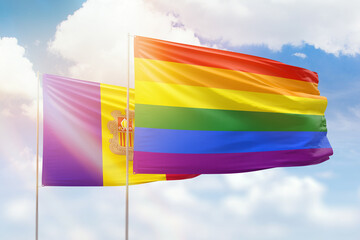 Sunny blue sky and flags of lgbt and andorra
