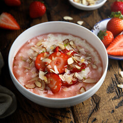 Homemade porridge with strawberry and almond