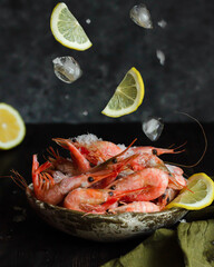 Raw delicious shrimps on dark background. Levitation food photography.