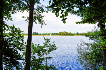 Ehrlichsee near Oberhausen-Rheinhausen. Lake with surrounding landscape in summer.
