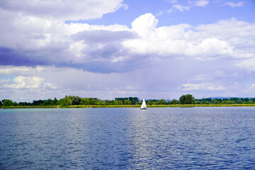 Ehrlichsee near Oberhausen-Rheinhausen. Lake with surrounding landscape in summer.
