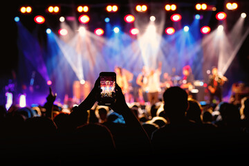 Fototapeta na wymiar Video recording of the concert using a smartphone
