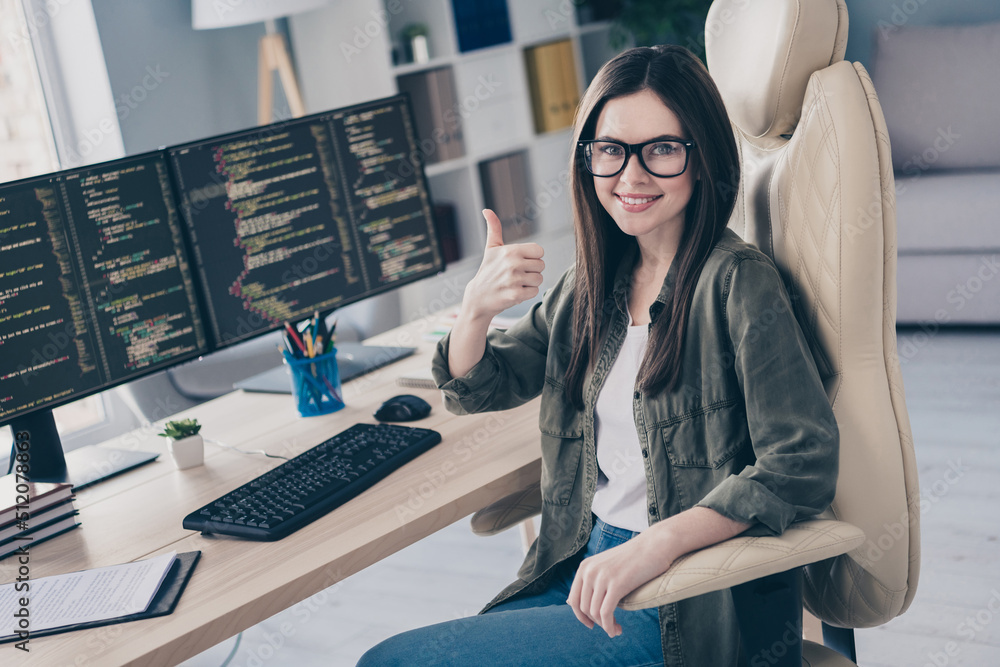 Aufkleber portrait of beautiful cheerful skilled girl tech leader showing thumbup developing web project at wo