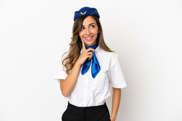 Airplane stewardess over isolated white background thinking an idea while looking up