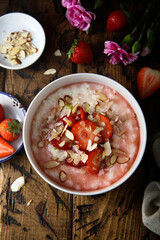 Homemade porridge with strawberry and almond