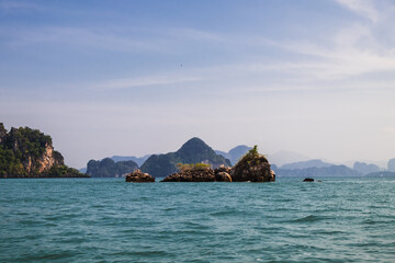 Rocks and cliffs protruding from the sea in Krabi province, Thailand