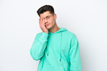 Young handsome caucasian man isolated on white bakcground with headache